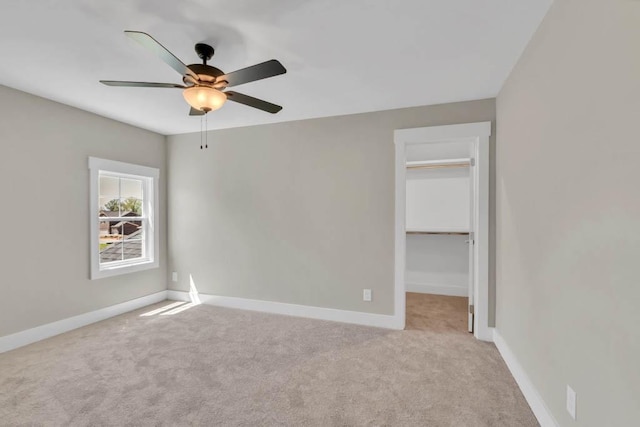 919 Licinius Ln, Murfreesboro, TN 37128 - unfurnished bedroom with a walk in closet, ceiling fan, baseboards, and carpet