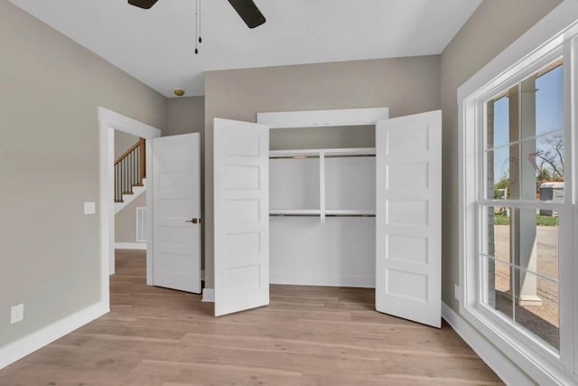 919 Licinius Ln, Murfreesboro, TN 37128 - unfurnished bedroom featuring light wood-style flooring, a closet, baseboards, and ceiling fan