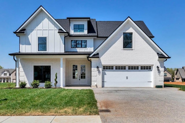 919 Licinius Ln, Murfreesboro, TN 37128 - view of front of property featuring board and batten siding, french doors, an attached garage, and driveway