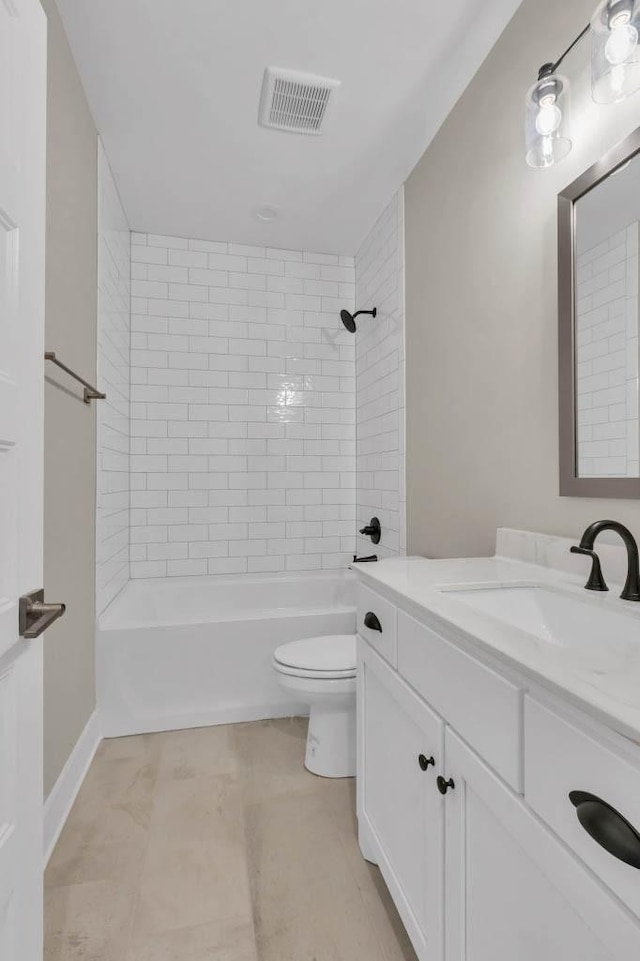 919 Licinius Ln, Murfreesboro, TN 37128 - bathroom featuring vanity, visible vents, toilet, washtub / shower combination, and baseboards