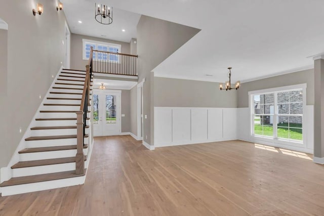 919 Licinius Ln, Murfreesboro, TN 37128 - foyer with wood-type flooring, a wealth of natural light, a chandelier, and stairs