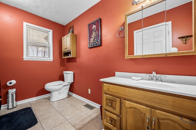 bathroom with visible vents, toilet, tile patterned floors, a textured ceiling, and vanity