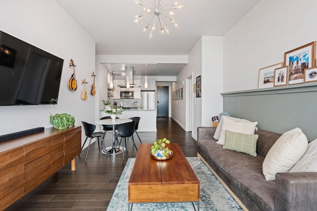 living room featuring baseboards, dark wood finished floors, and a notable chandelier