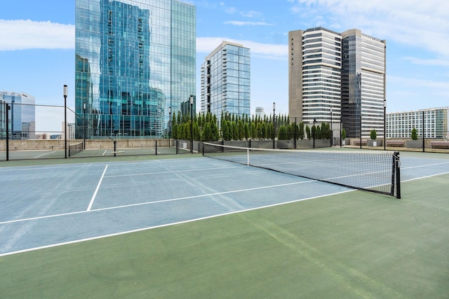 view of sport court featuring fence