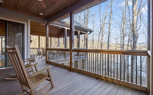 wooden deck featuring a ceiling fan