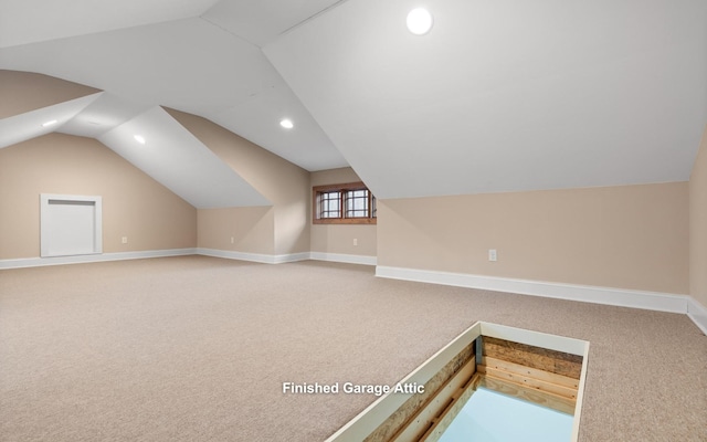 bonus room with lofted ceiling, carpet, and baseboards