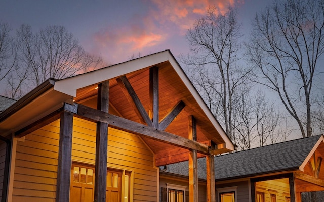 exterior space with a shingled roof