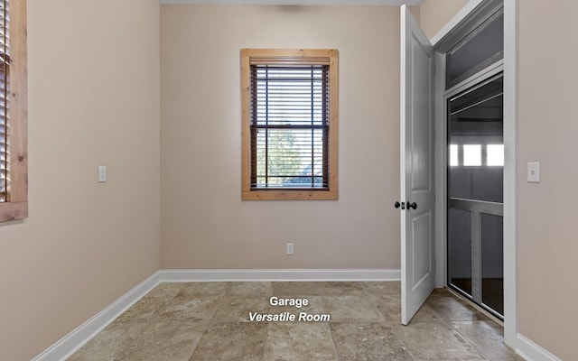 interior space with plenty of natural light and baseboards