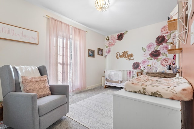 carpeted bedroom with baseboards