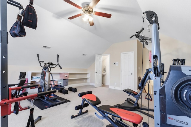 exercise room featuring carpet, lofted ceiling, visible vents, a ceiling fan, and baseboards