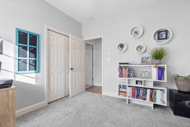 interior space featuring carpet and baseboards