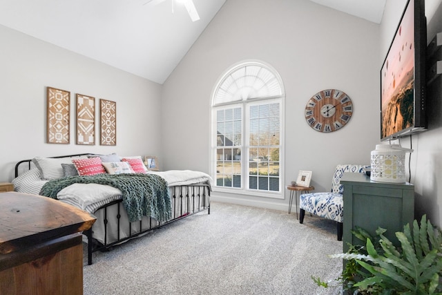 bedroom with carpet floors, high vaulted ceiling, and a ceiling fan