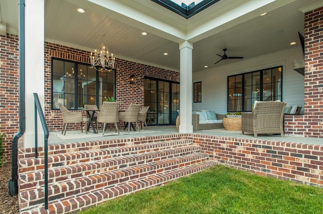 view of patio featuring ceiling fan