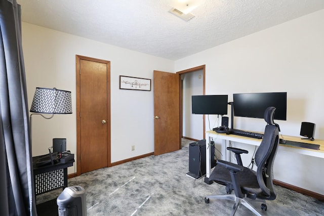 home office with baseboards, visible vents, a textured ceiling, and carpet flooring