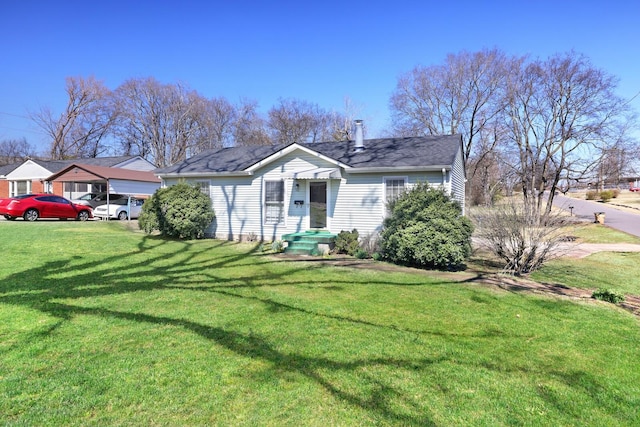 bungalow-style home featuring a front lawn