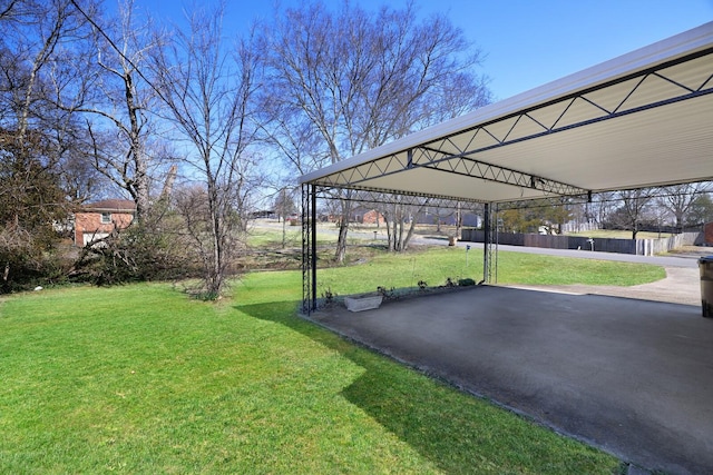 view of yard with a carport, a patio, and a gazebo