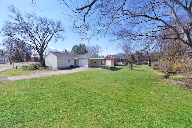 ranch-style house featuring driveway, a front lawn, and an attached garage