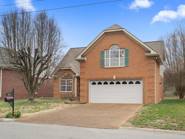 traditional home with brick siding, a shingled roof, an attached garage, driveway, and a front lawn