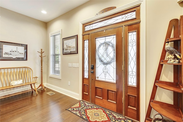 entryway featuring visible vents, baseboards, dark wood-style flooring, and recessed lighting