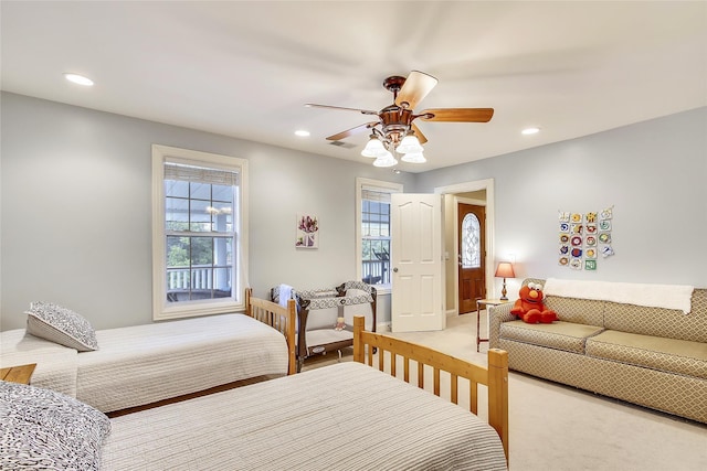 bedroom with light colored carpet, recessed lighting, and visible vents