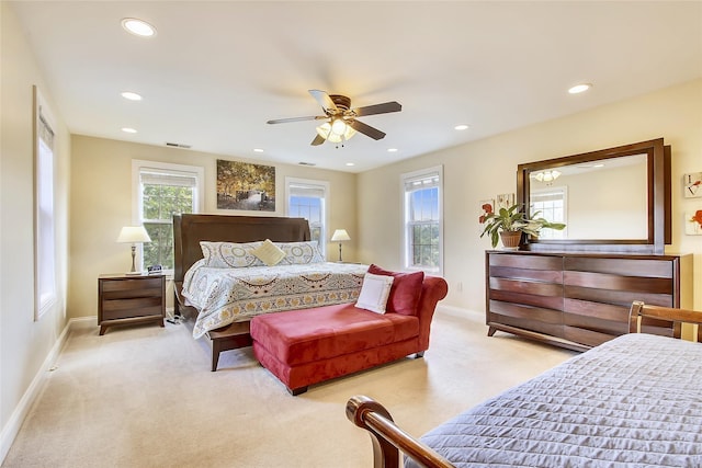 bedroom with carpet floors, recessed lighting, visible vents, and baseboards