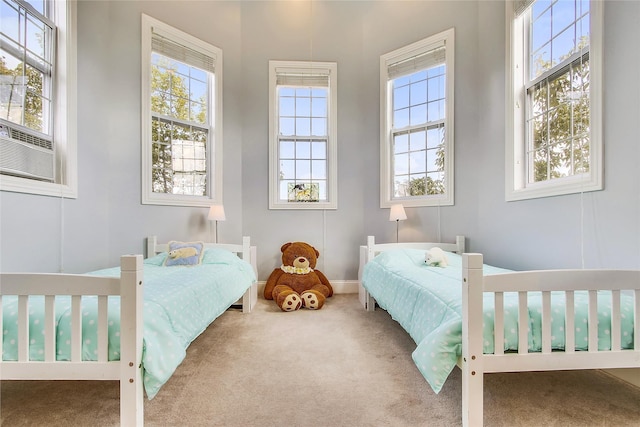 bedroom featuring carpet floors and cooling unit