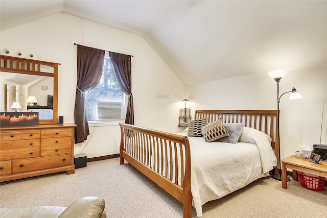 carpeted bedroom featuring cooling unit and vaulted ceiling