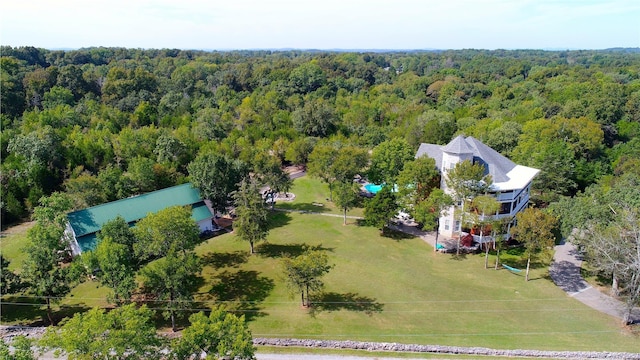 birds eye view of property with a forest view