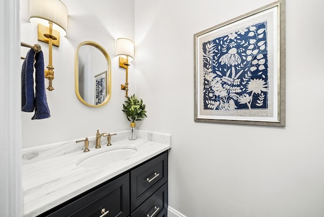 bathroom with vanity and baseboards