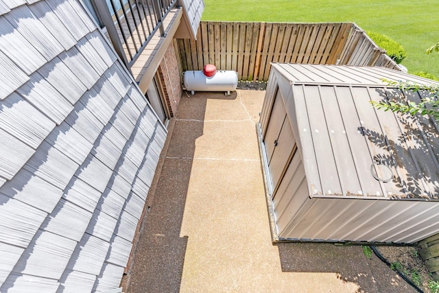 wooden terrace featuring a lawn and fence