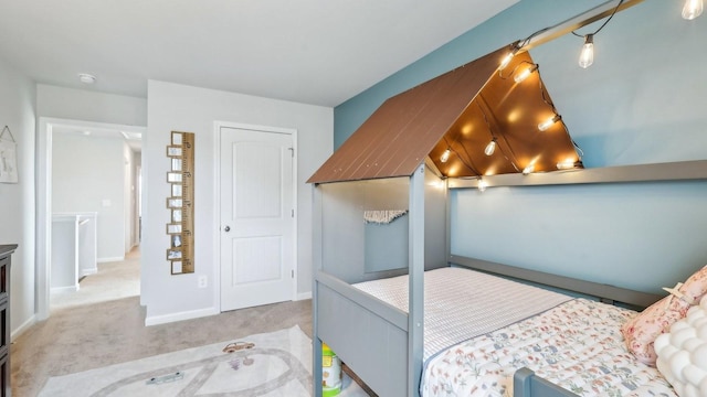 carpeted bedroom with baseboards