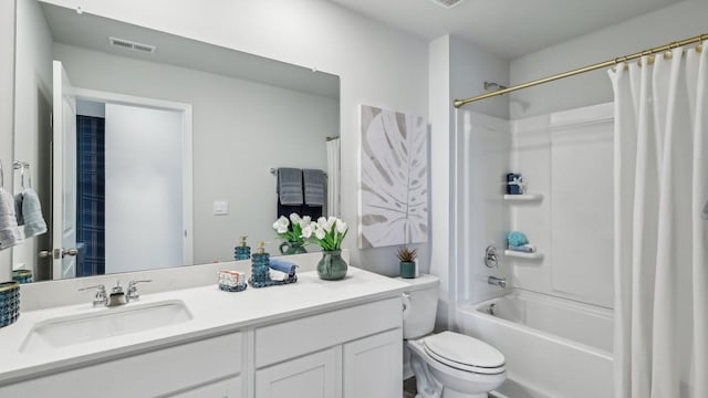 bathroom featuring toilet, shower / bath combo with shower curtain, vanity, and visible vents