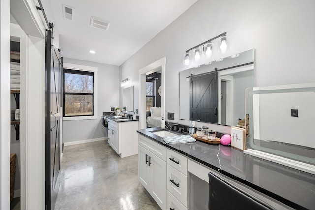 full bathroom with baseboards, finished concrete floors, visible vents, and vanity