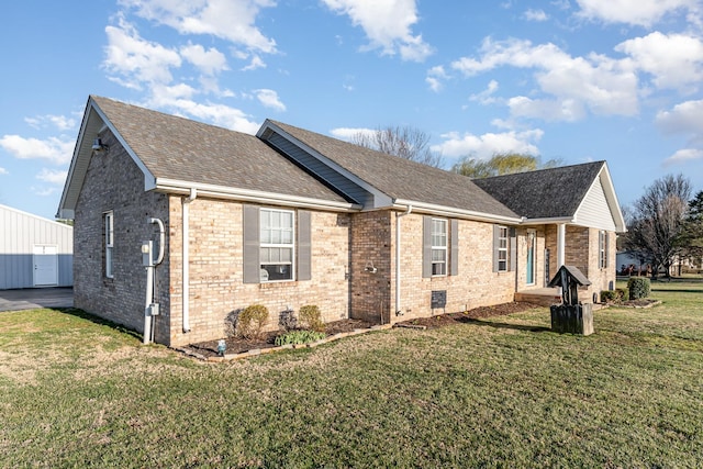 view of home's exterior with crawl space, a lawn, brick siding, and a shingled roof