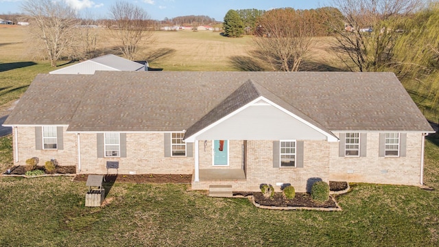 view of front of property with crawl space, brick siding, and a front yard