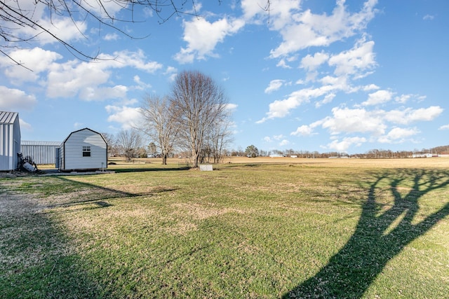 view of yard featuring a storage shed and an outdoor structure