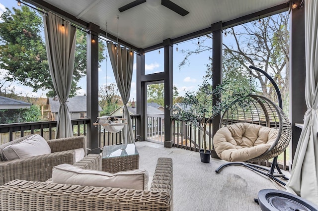 sunroom with a ceiling fan