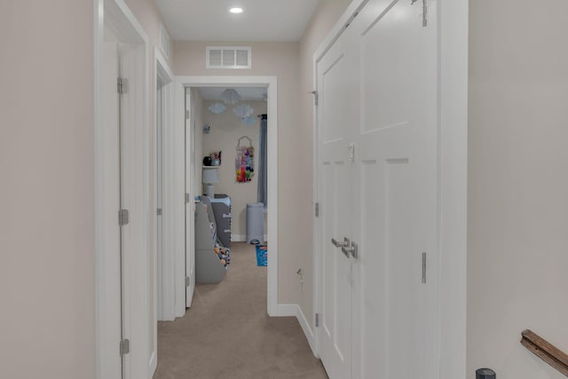 hall with light carpet, recessed lighting, visible vents, and baseboards