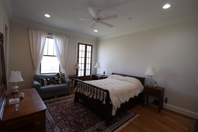 bedroom featuring crown molding, recessed lighting, wood finished floors, and baseboards