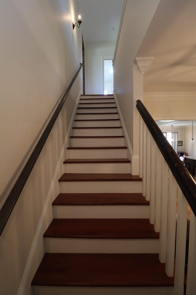 stairway with crown molding