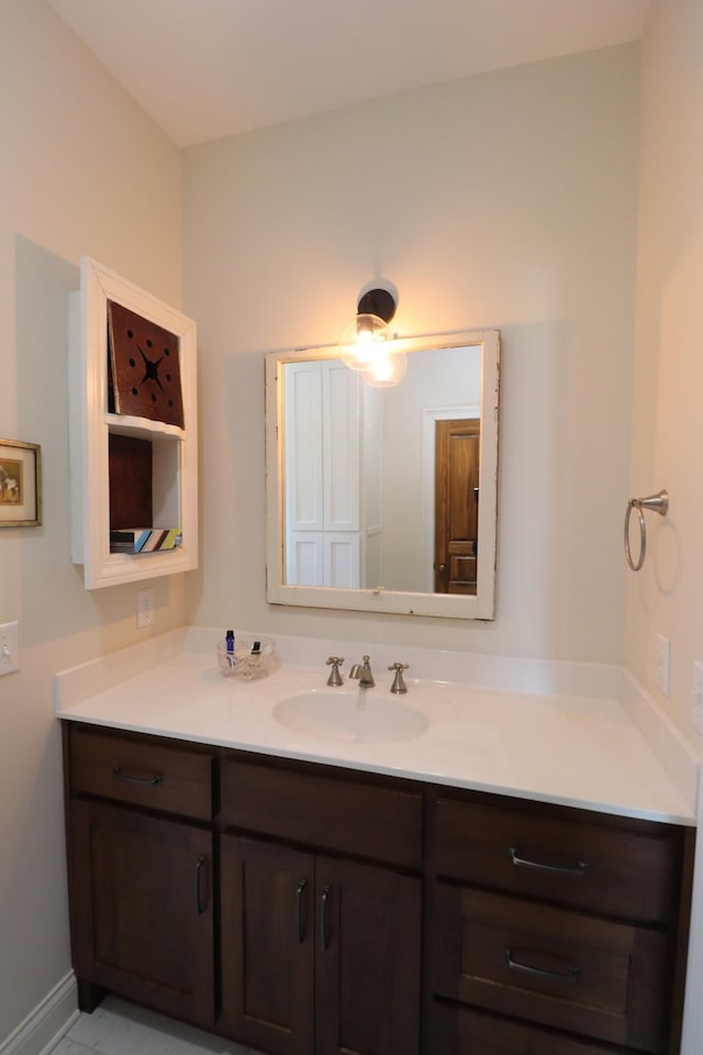 bathroom featuring vanity and baseboards