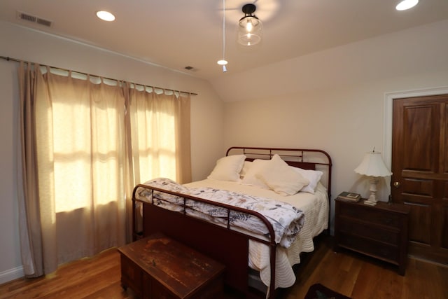 bedroom featuring recessed lighting, visible vents, lofted ceiling, and wood finished floors