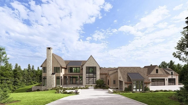 view of front facade with a standing seam roof, stone siding, a chimney, and a front yard