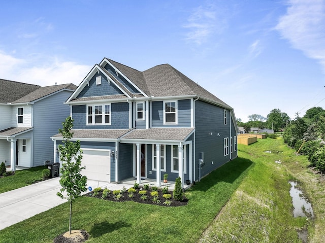 view of front facade with driveway, a garage, a shingled roof, covered porch, and a front lawn