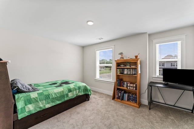 bedroom with carpet, visible vents, and baseboards