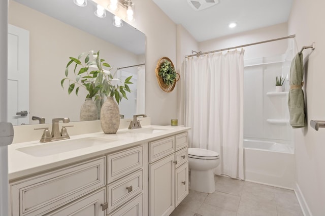 bathroom featuring shower / bath combination with curtain, tile patterned flooring, a sink, and visible vents