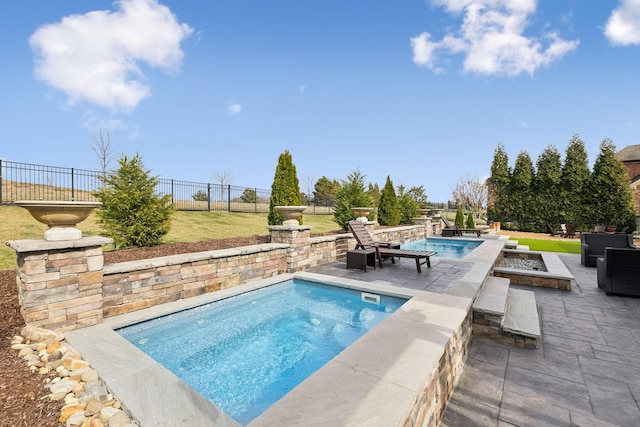 view of pool with a fire pit, a patio area, a fenced backyard, and a fenced in pool