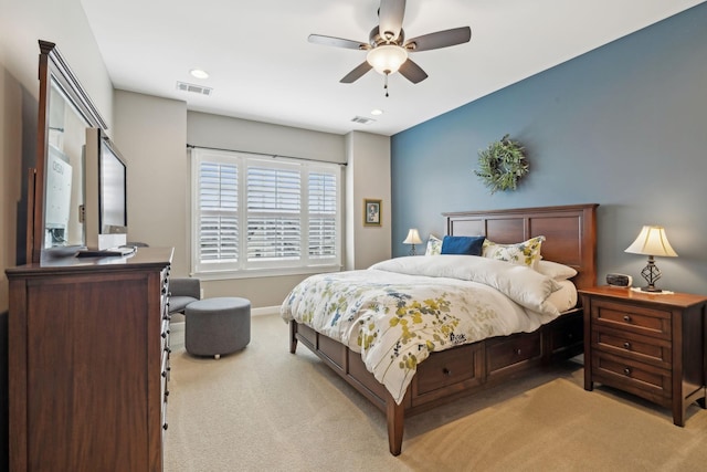 bedroom with recessed lighting, visible vents, light carpet, and baseboards