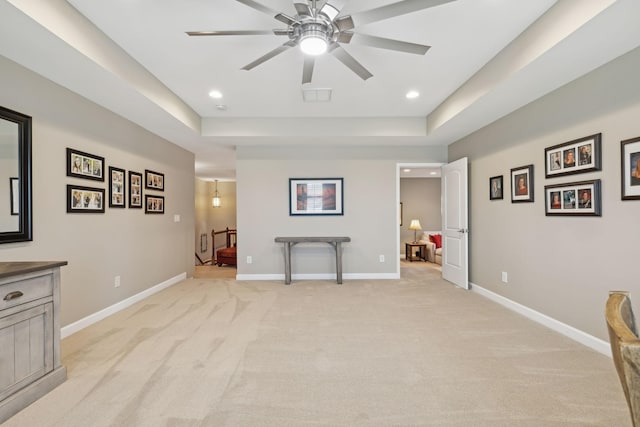 interior space with visible vents, recessed lighting, light colored carpet, and baseboards