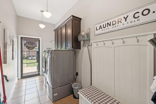 laundry area featuring cabinet space, light tile patterned flooring, and independent washer and dryer